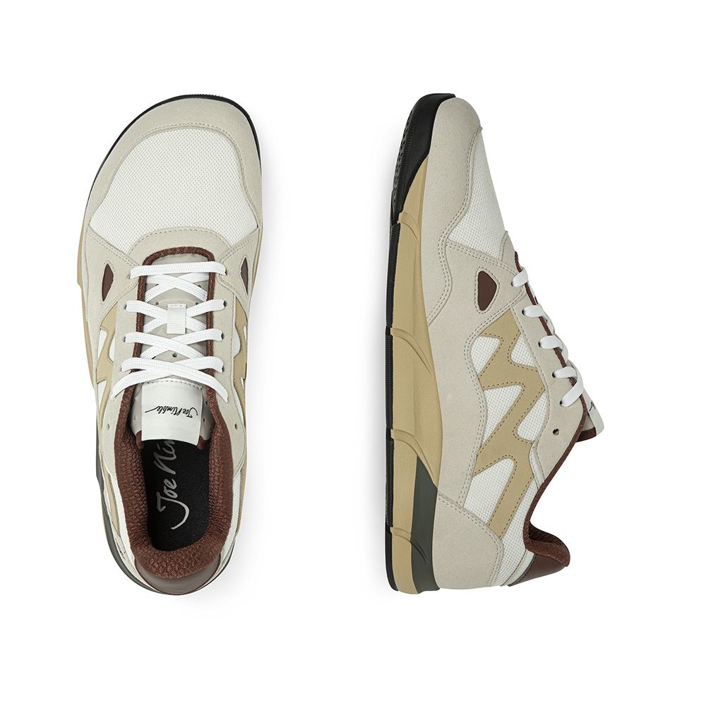 Joe Nimble Sneaker Addict barfotasko i svart, brun och sandfärgad kombination. Bred tåbox, andningsbar ovandel i mesh och lågprofilsdesign för naturlig fotrörelse.